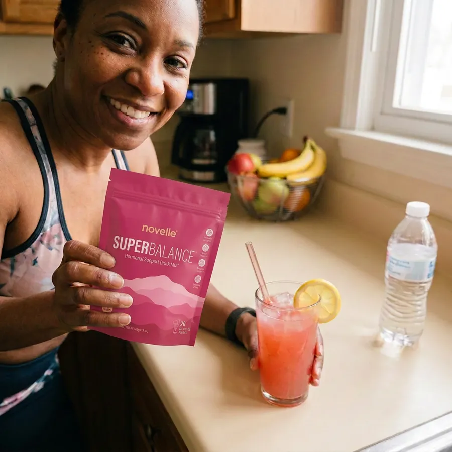 Danielle with a SuperBalance stick pack and a glass of strawberry lemonade